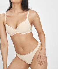 Woman wearing low rise, toasted almond No Show Thong by LIVELY