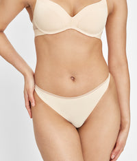 Woman wearing small, toasted almond No Show Thong underwear by LIVELY