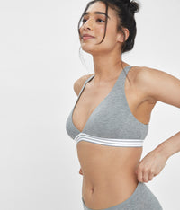 Woman wearing Heather Gray Cross Back Bralette by LIVELY