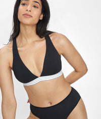 Woman wearing Jet Black Cross Back Bralette made of all-day modal fabric by LIVELY
