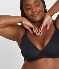 Smiling woman wearing All-Day Plunge No-Wire Bra in Jet Black by LIVELY
