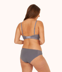 back of model in palm lace busty bralette smoke grey